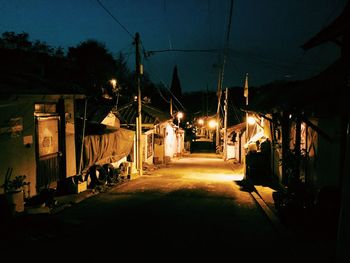 Empty illuminated street light at night