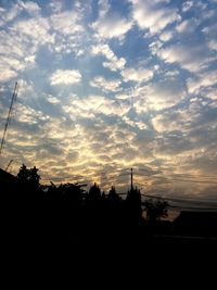 Silhouette landscape against sky during sunset