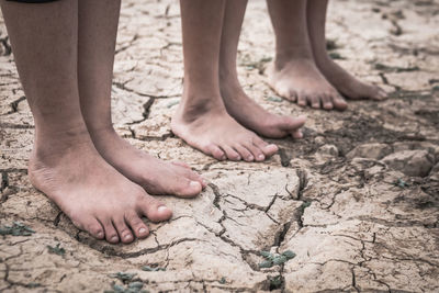 Low section of child on sand