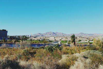 Scenic view of mountains against clear blue sky