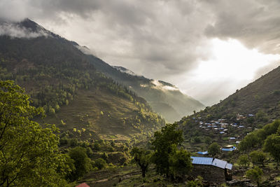 Scenic view of landscape and mountains against sky