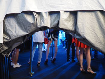 Low section of people standing in traditional clothing