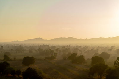 Scenic view of mountains against sky during sunset