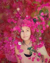 Portrait of woman with pink flowers