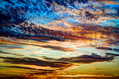 Scenic view of cloudy sky at sunset