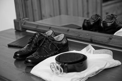 Close-up of shoes on table