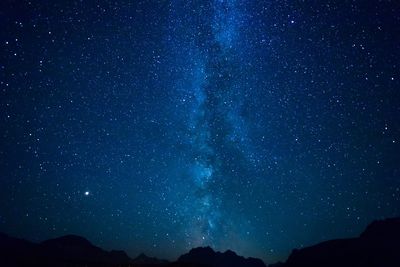 Low angle view of star field against sky at night