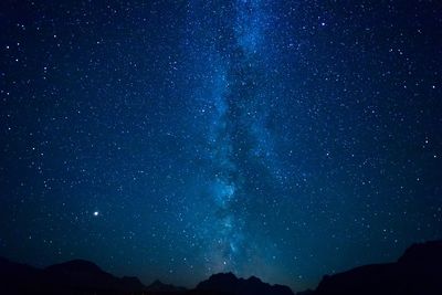 Low angle view of star field against sky at night