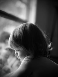 Close-up portrait of cute girl at home