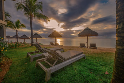 Scenic view of beach against sky during sunset