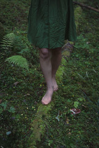 Close up barefoot walking in forest concept photo