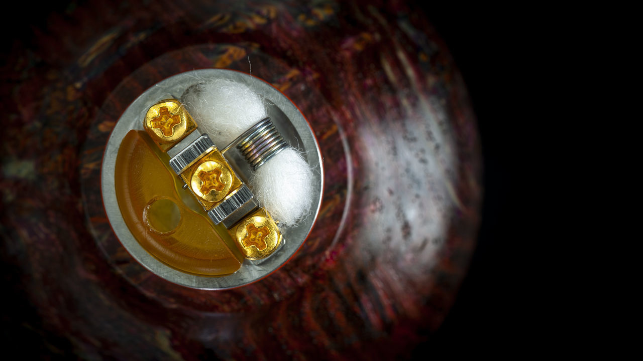 HIGH ANGLE VIEW OF COFFEE ON TABLE AGAINST BLACK BACKGROUND