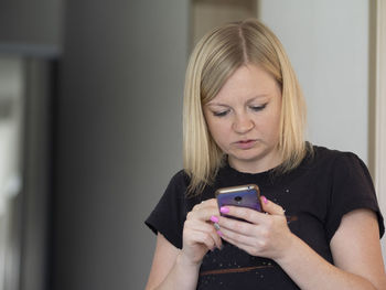 Young woman using mobile phone