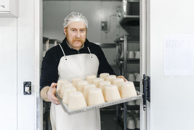 Portrait of man preparing food