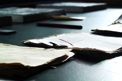 Close-up of papers on table