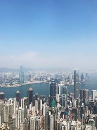 Aerial view of modern buildings in city against sky