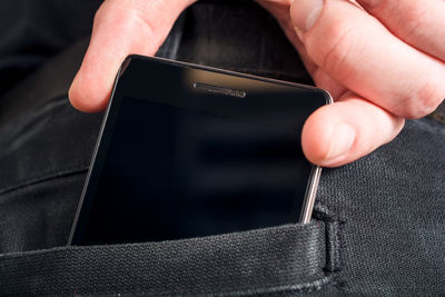 Close-up of person holding mobile phone