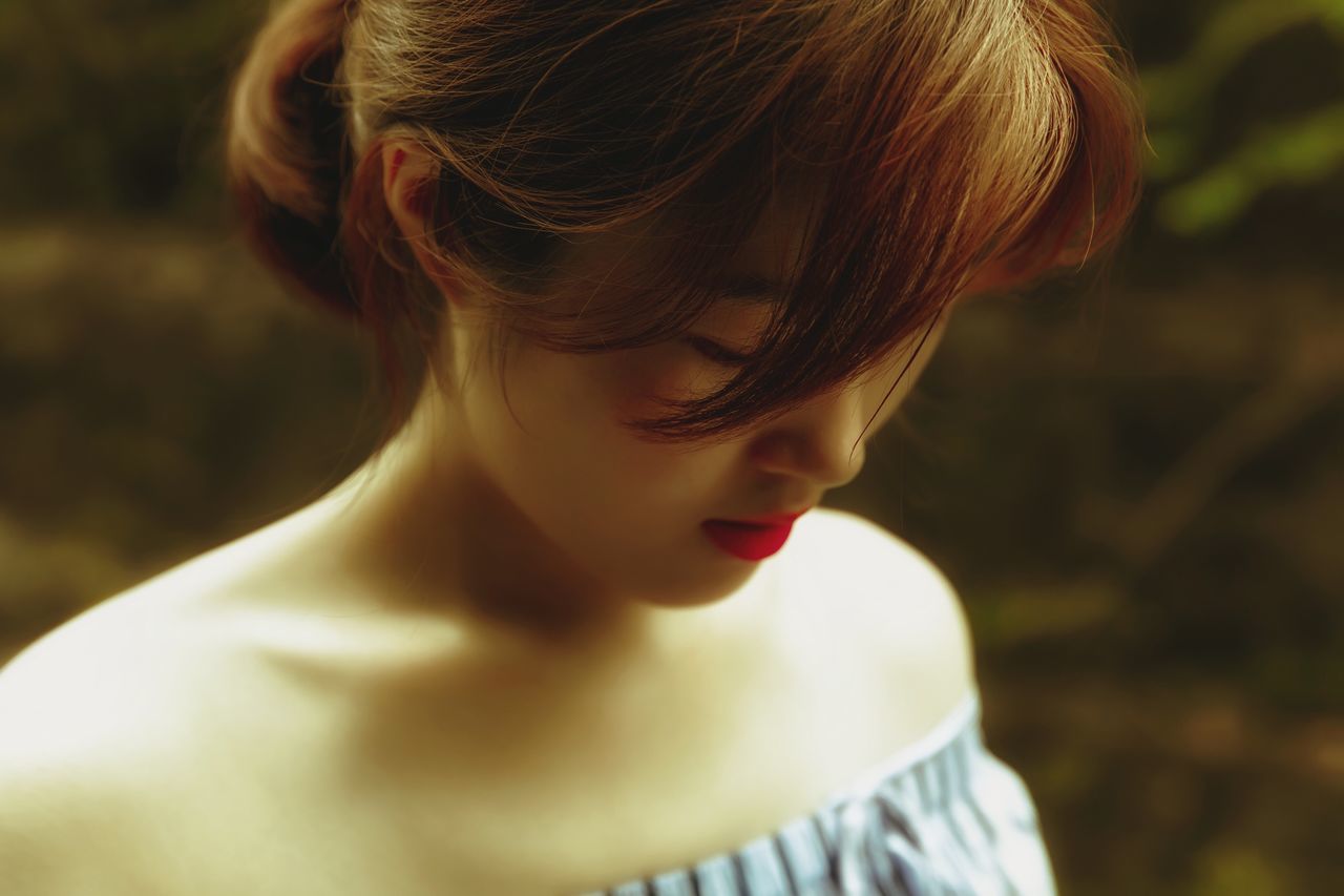 headshot, focus on foreground, one person, child, looking, real people, women, looking down, childhood, portrait, lifestyles, girls, leisure activity, close-up, females, hair, hairstyle, day, contemplation, innocence, beautiful woman, human hair