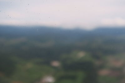 Full frame shot of raindrops on windshield