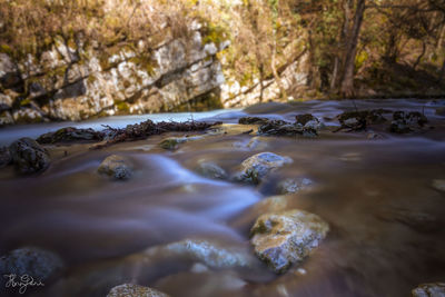 Surface level of water flowing through rocks