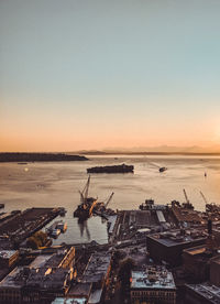 Scenic view of sea against clear sky during sunset