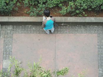 Full length of woman standing by railing