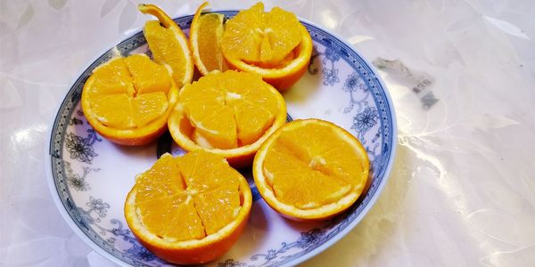 High angle view of orange slices in plate on table