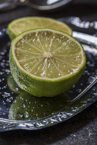 High angle view of lemon in plate on table