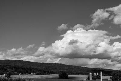 Scenic view of house and buildings against sky