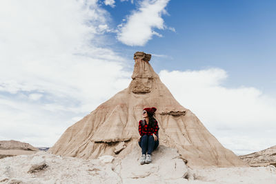 Low angle view of rock formation on mountain against sky