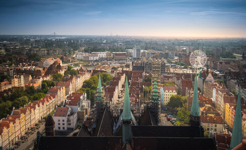 High angle view of city buildings against sky