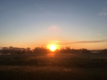 Scenic view of landscape at sunset