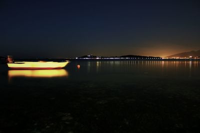 Reflection of illuminated buildings in water