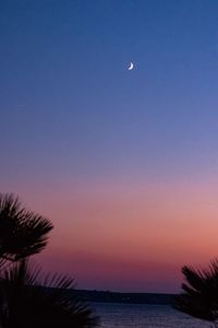 Scenic view of sea against sky at dusk