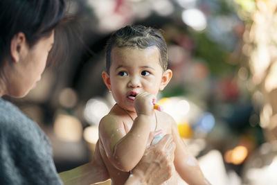 Portrait of cute baby boy outdoors