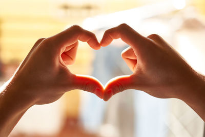 Cropped hand of woman holding hands
