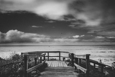 Pier over sea against sky