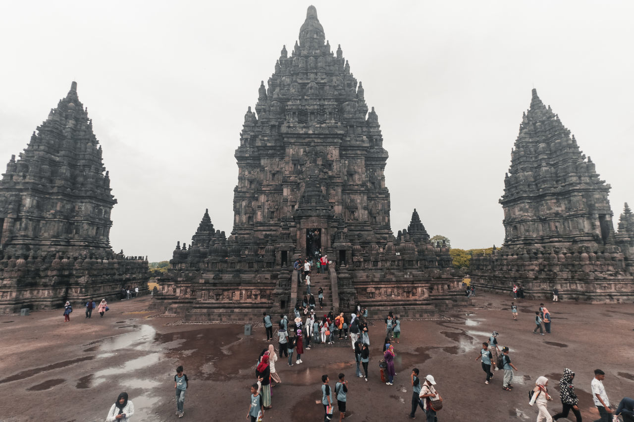 GROUP OF PEOPLE IN FRONT OF TEMPLE