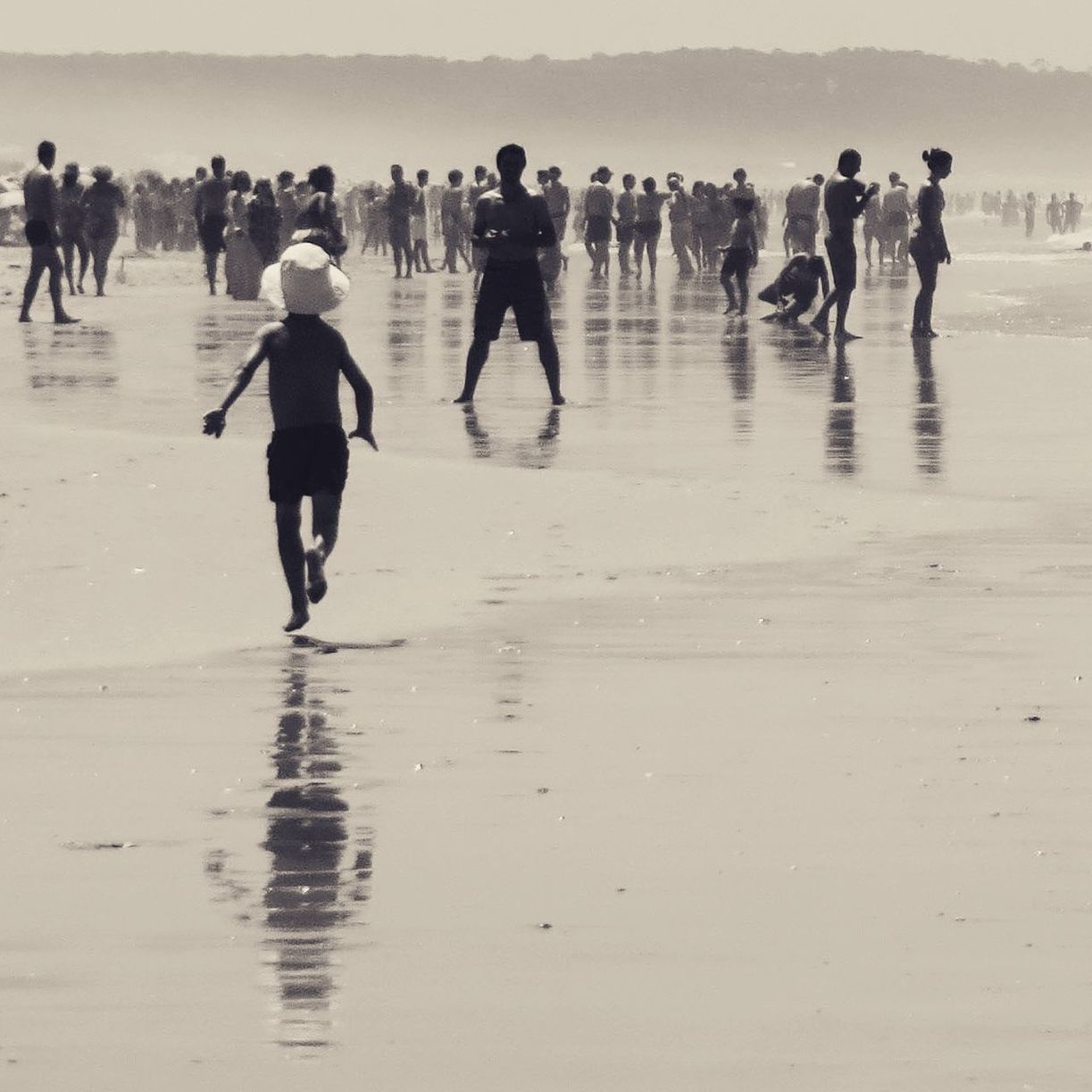 PEOPLE WALKING AT BEACH