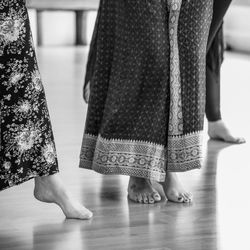 Low section of women standing on floor