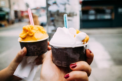 Close-up of hand holding ice cream