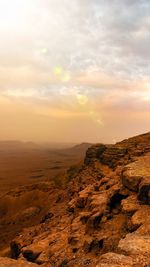 Scenic view of landscape against sky during sunset