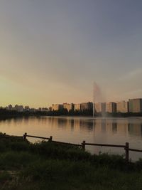 Scenic view of river against sky during sunset