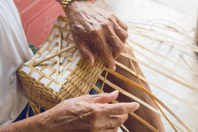 Close-up of man holding basket