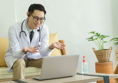 Young man using laptop on table