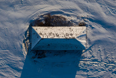 High angle view of text on snow covered land