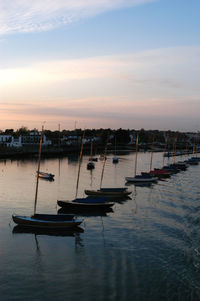 Boats in marina at sunset