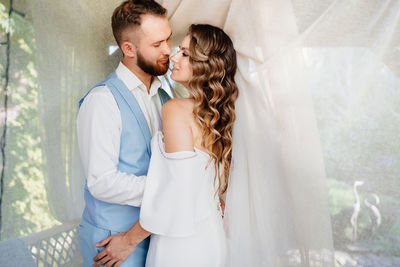 Young couple standing outdoors