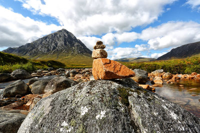 Rocks on mountain against sky