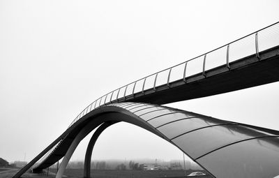 Low angle view of footbridge against clear sky